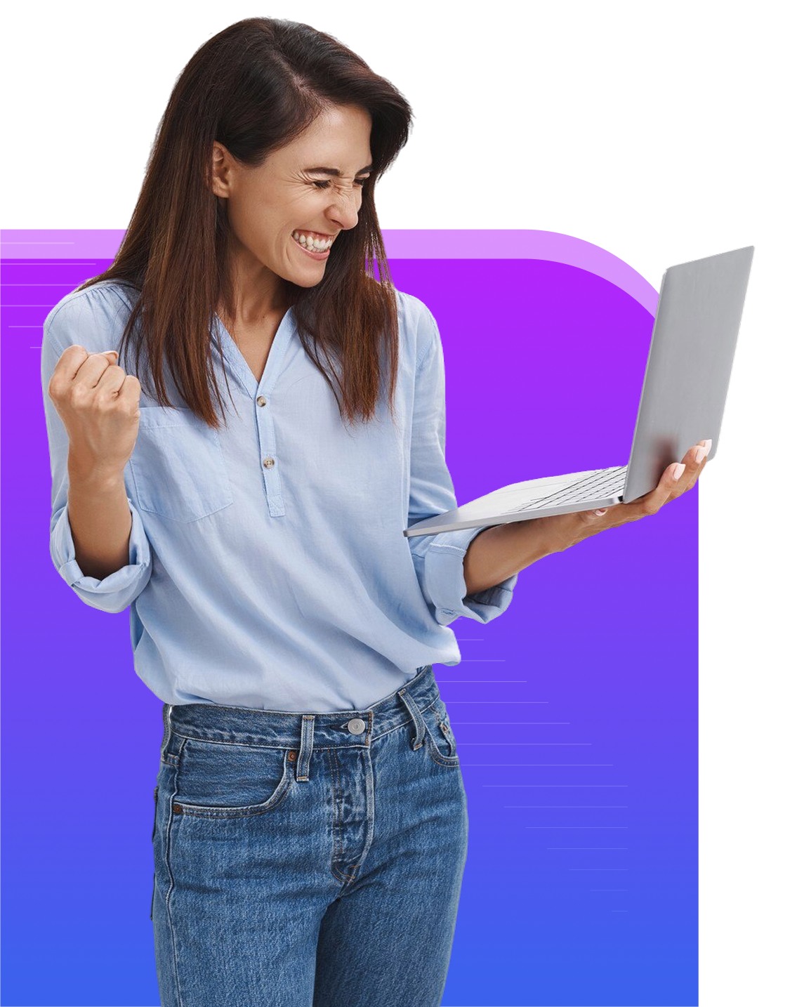 Woman celebrates success while holding a laptop, wearing jeans and a blue shirt.